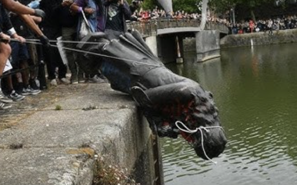 The removal of the Edward Colston statue, Bristol, June 7, 2020. The statue, erected in 1895 to commemorate a merchant whose wealth derived substantially from the slave trade, was toppled during Black Lives Matter protests and subsequently rolled into Bristol Harbour.